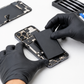 Technician replacing an iPhone battery